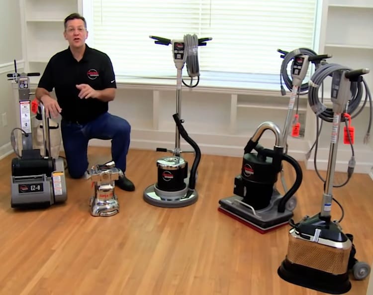 Floor Sander Equipment next to a Refinishing Professional
