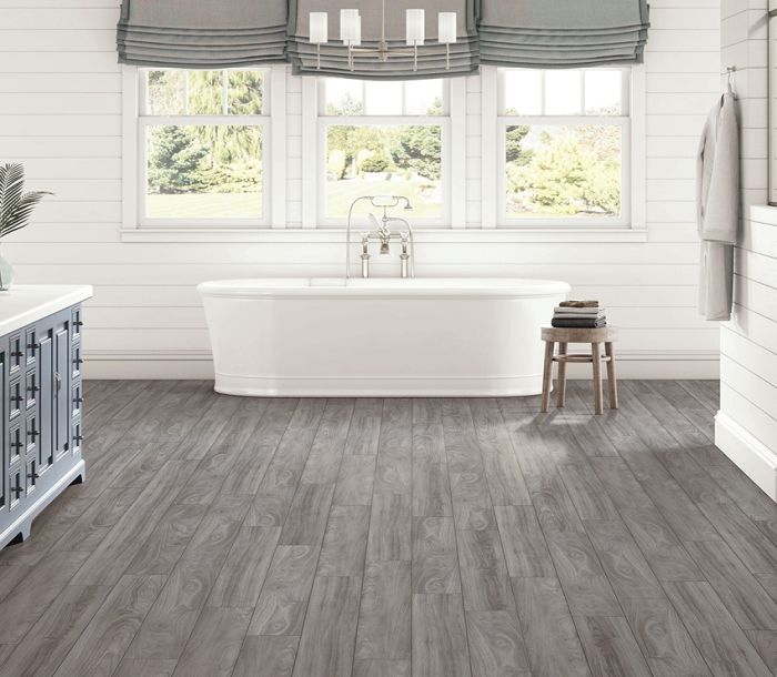 Dusty gray vinyl plank flooring installed in a room