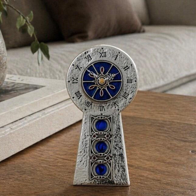 Knox style hammered pewter clock with starburst enamel centre and Celtic knot roundels
