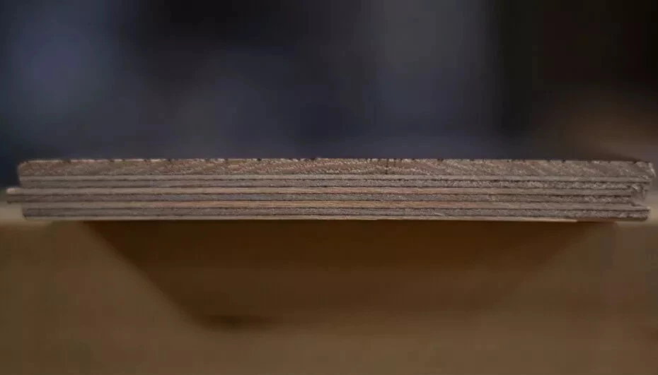 Cross-section of an engineered hardwood board showing multiple layers
