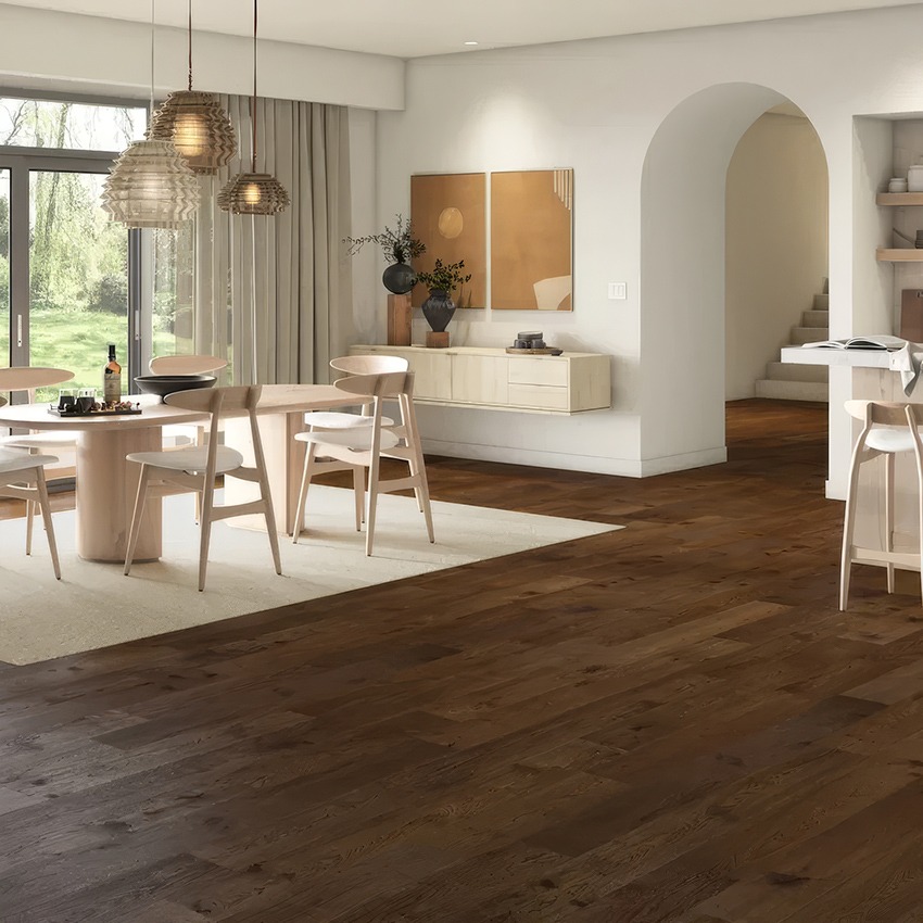 Dark wide plank engineered hardwood floor in a modern living room and dining room