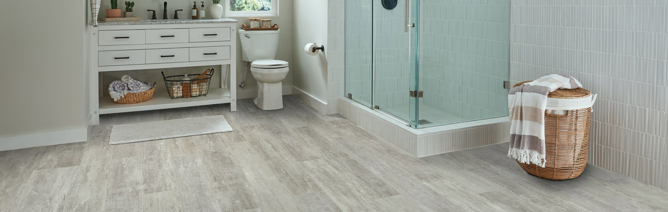Gray vinyl plank flooring in a bathroom
