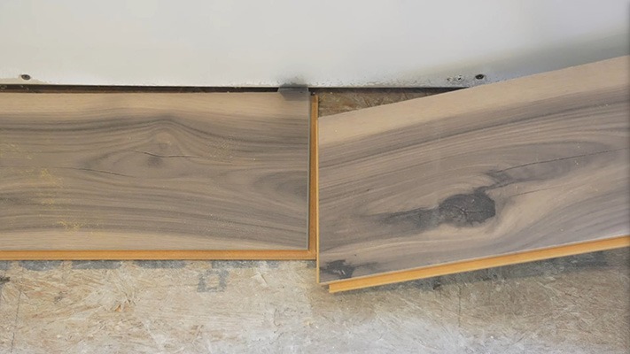 Laminate plank inserting into the previous board