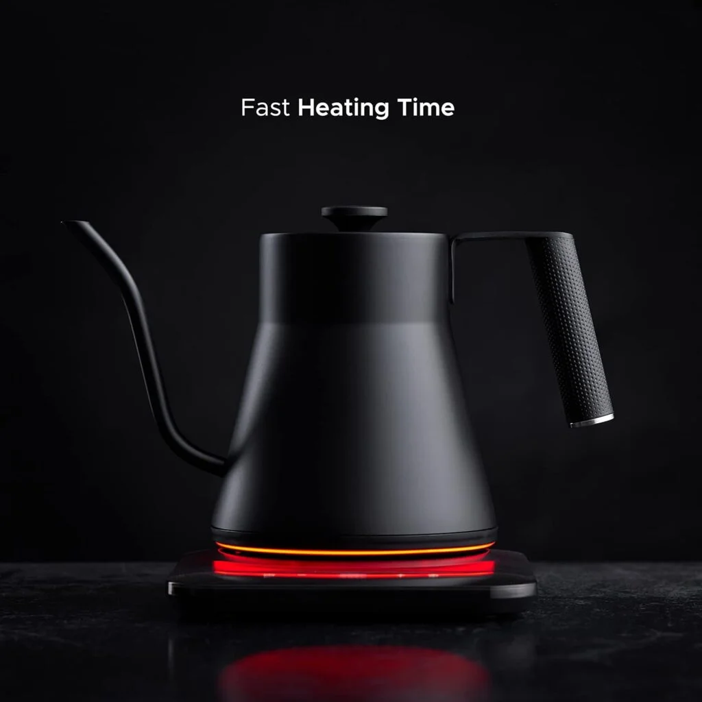 Black electric gooseneck kettle on its heating base