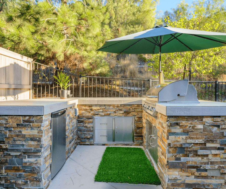 Custom outdoor kitchen paired with paver patio hardscape