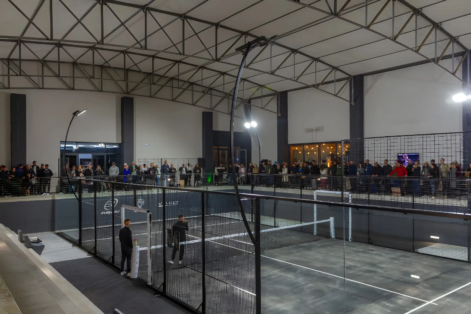 Indoor padel court with spectators