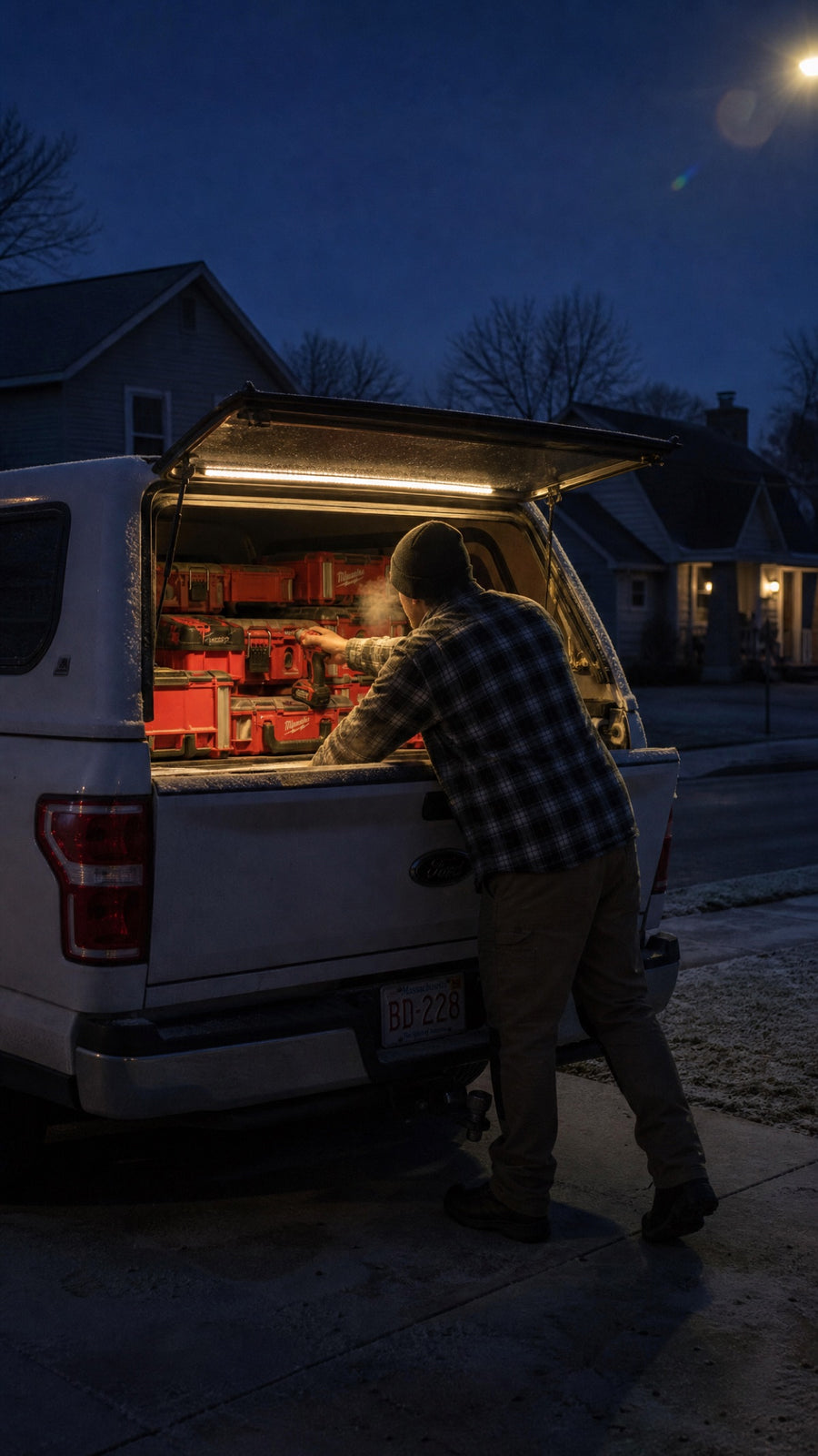 Pre-dawn driveway with a lit truck cap using a battery adapter kit
