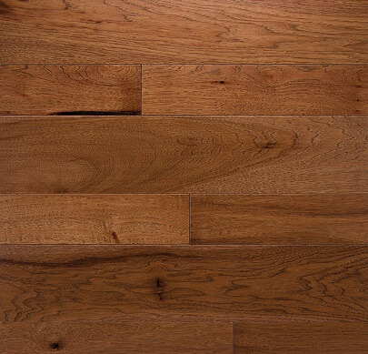 Brown hardwood planks with varied grain and knots in a staggered pattern
