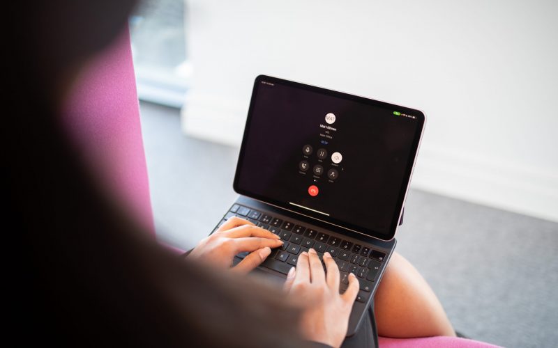 Laptop screen displaying unified communications for business platform with calls and messaging