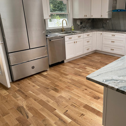Customer showing completed hardwood floor refresh