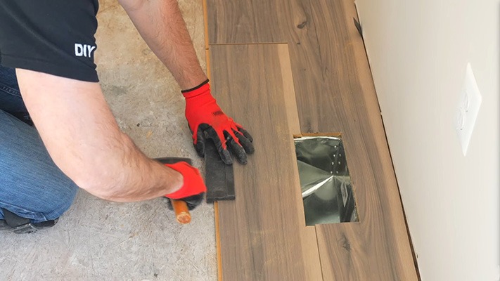 Tapping block for a laminate flooring installation