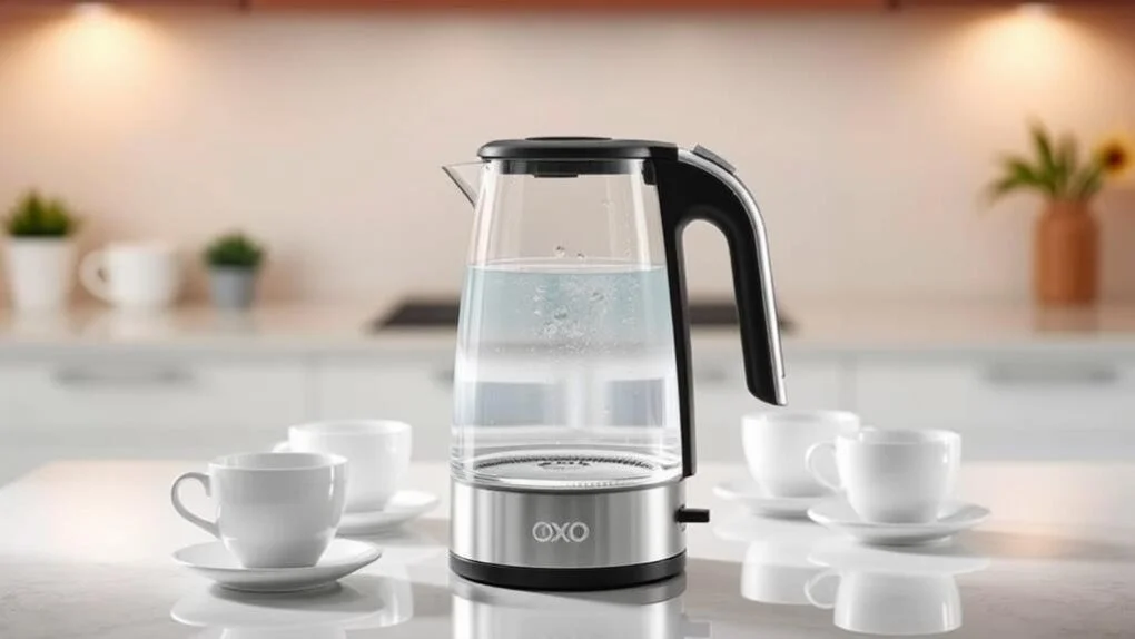 Clear glass electric kettle beside cups on a counter