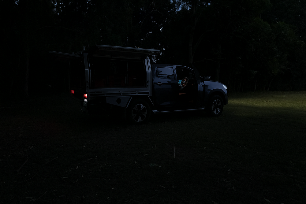 Ute with 18V battery powered LED light illuminating storage at dusk