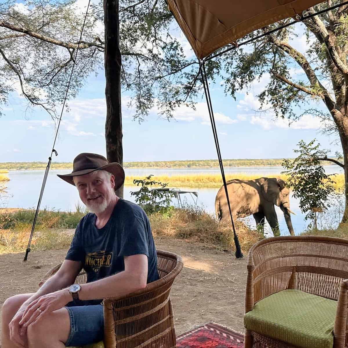 Andy on safari near an elephant in Zambia